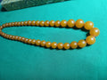 Collier en bakélite de couleur orange 1950