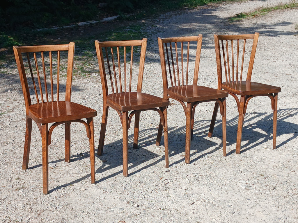 quatre chaises de bistrot Baumann en bois massif  1950