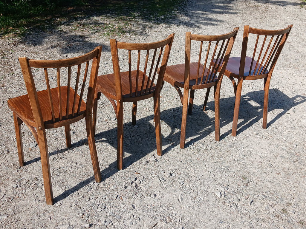 quatre chaises de bistrot Baumann en bois massif  1950