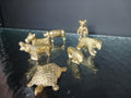 Ensemble de sept miniatures anciennes en laiton massif